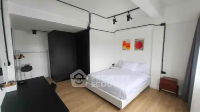 Modern minimalist bedroom with sleek black accents and stylish decor