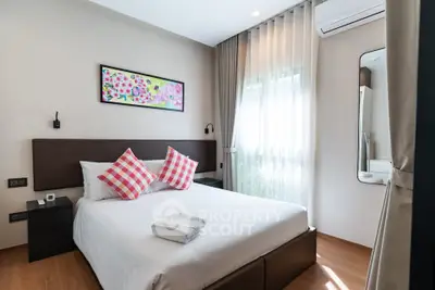 Charming bedroom with modern decor and natural light