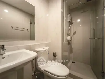 Modern bathroom with sleek shower and elegant fixtures