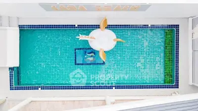 Stunning aerial view of a luxurious pool with a stylish float, perfect for relaxation and leisure.