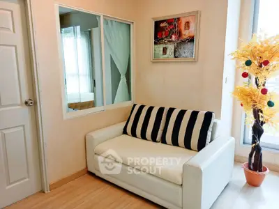 Cozy living room with stylish white sofa and decorative elements