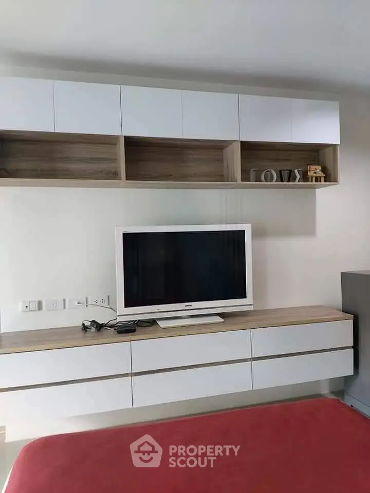 Modern living room with sleek TV unit and stylish shelving