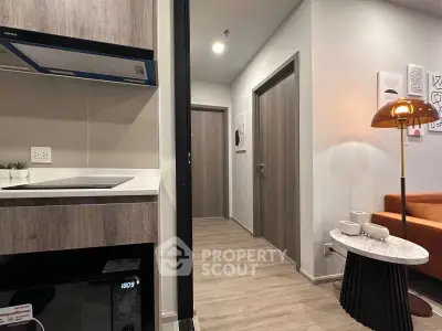 Modern apartment interior with sleek kitchen and cozy living area