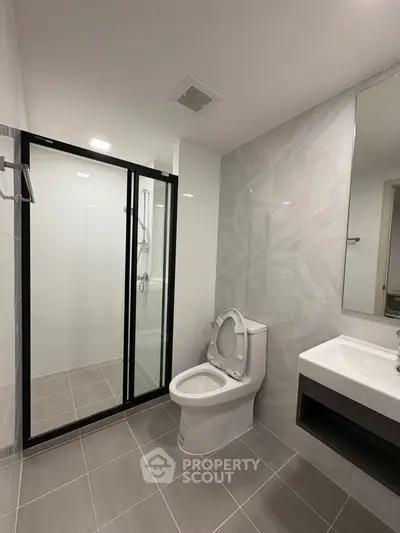 Modern bathroom with sleek shower and elegant fixtures