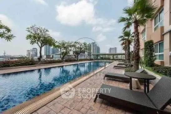 Luxurious apartment pool with city skyline view and palm trees