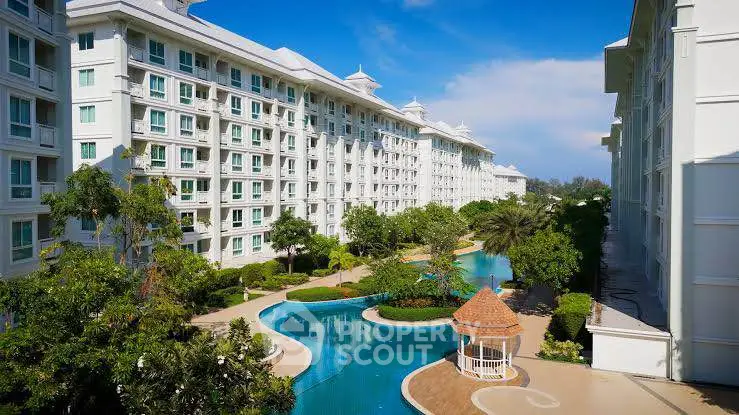 Luxurious condominium with stunning pool and lush gardens in prime location.