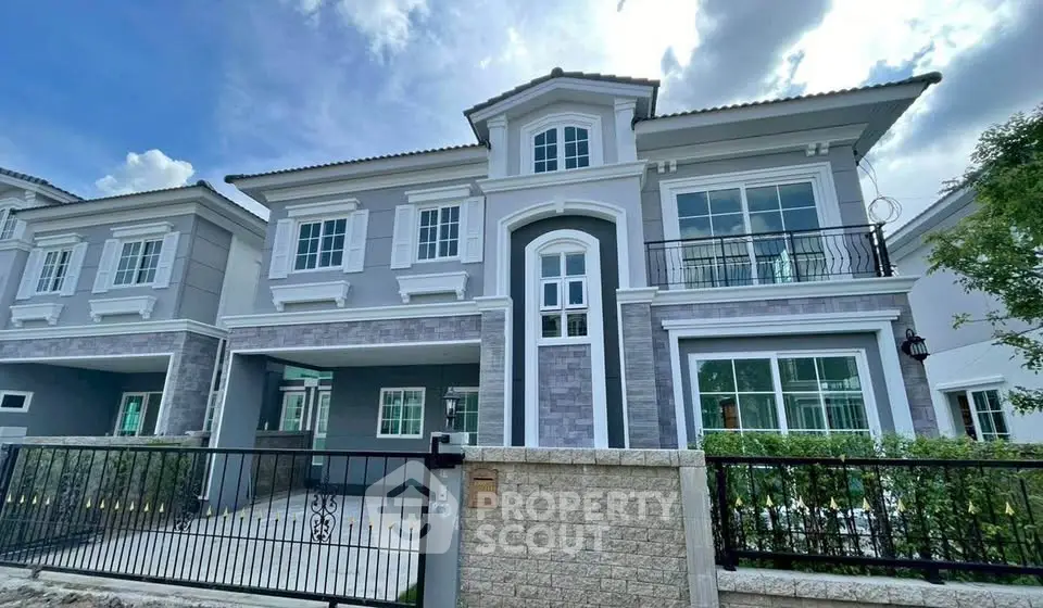 Elegant two-story house with modern facade and spacious balcony