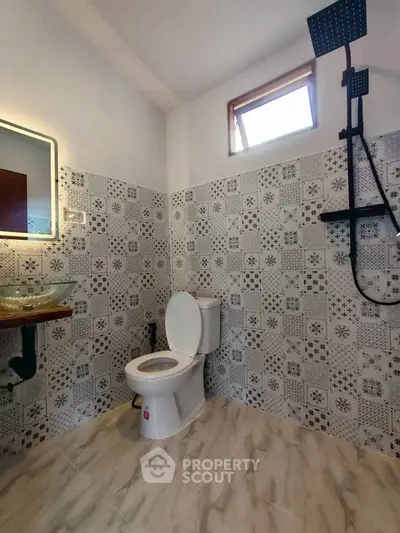 Modern bathroom with stylish tile design and sleek fixtures
