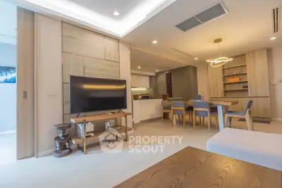 Modern open-plan living room with dining area and stylish furniture
