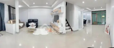 Spacious modern living room with sleek design and cozy seating area