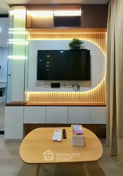 Modern living room with stylish TV wall unit and ambient lighting