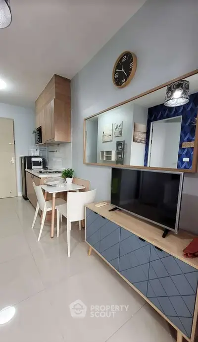 Modern living room with stylish furniture and open kitchen layout