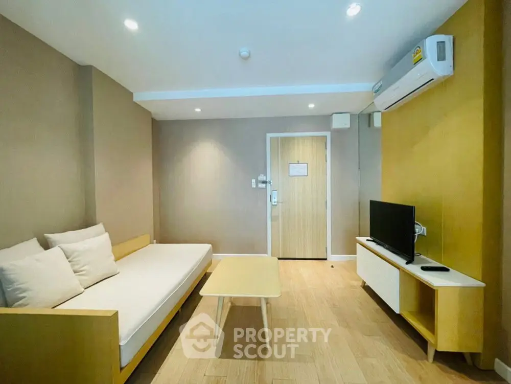 Modern living room with minimalist furniture and air conditioning