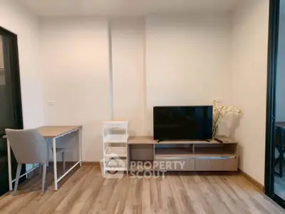 Modern living room with sleek TV stand and cozy workspace