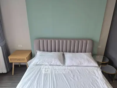 Modern bedroom with stylish headboard and side tables, perfect for a cozy and elegant living space.