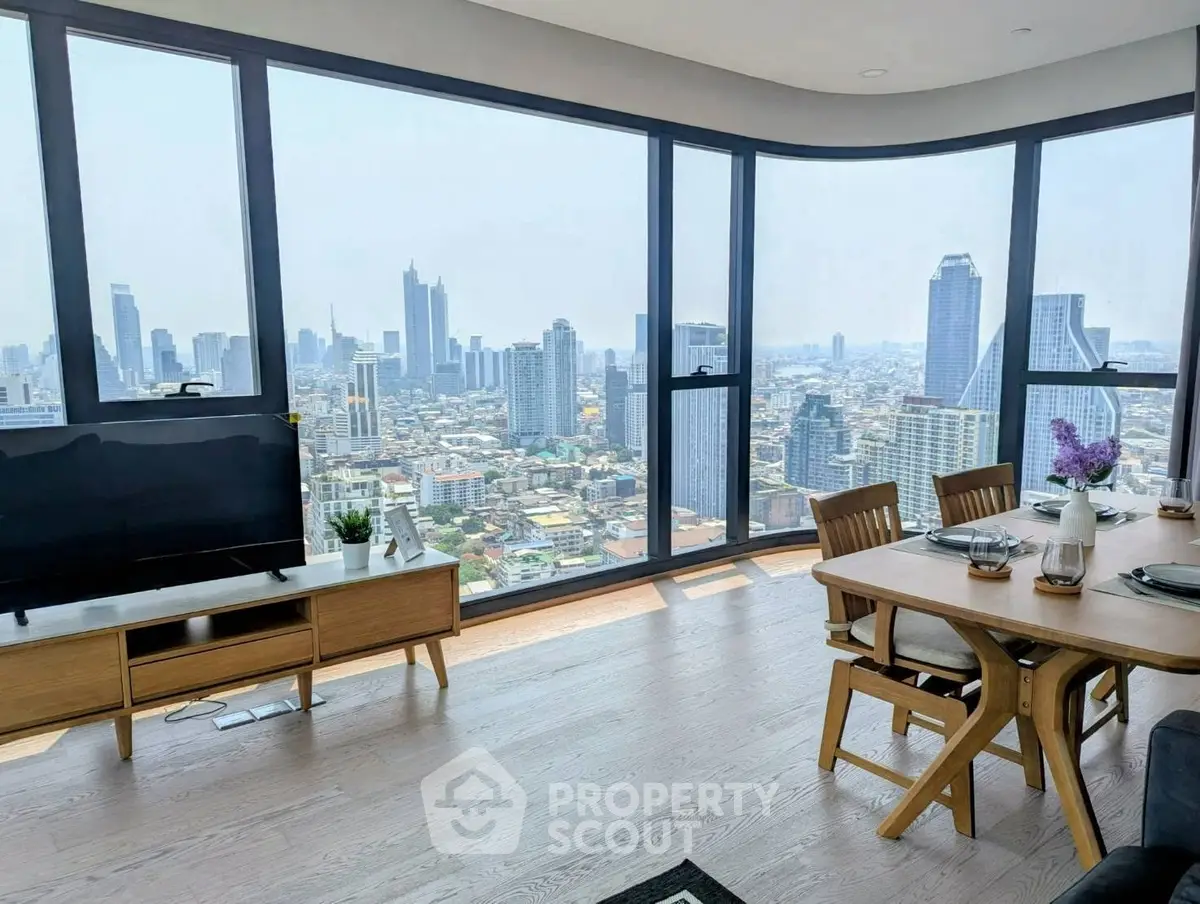 Stunning high-rise apartment with panoramic city views and modern dining area.