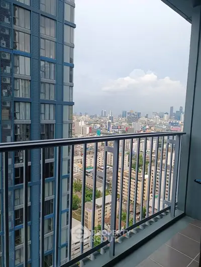 Stunning high-rise balcony view showcasing city skyline and modern architecture.