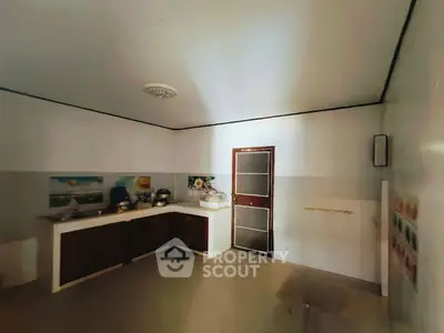 Spacious kitchen with closed layout and modern appliances