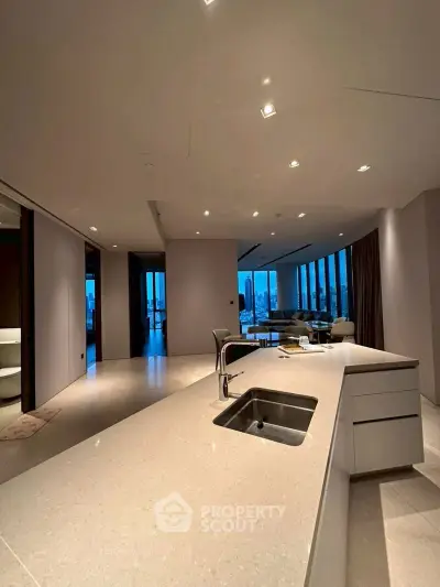 Luxurious open-plan kitchen with stunning city view and modern design