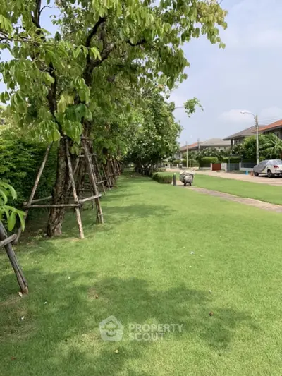 Lush green garden pathway in a serene residential neighborhood