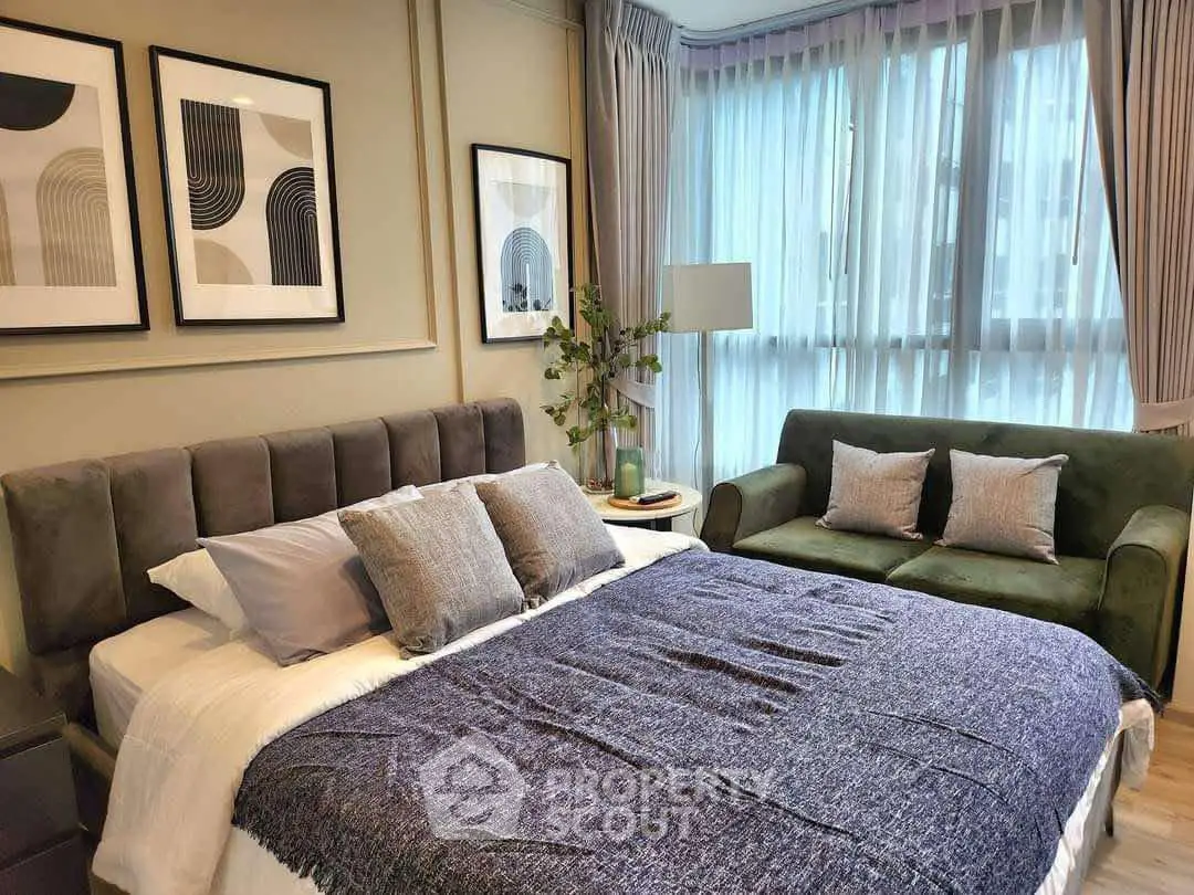 Luxurious bedroom with modern decor and large windows for natural light