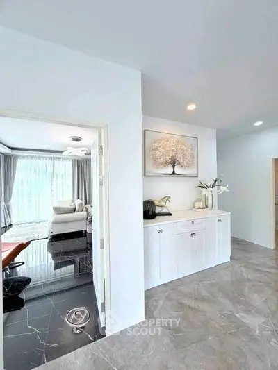 Modern interior with elegant decor and natural light in a stylish living space.