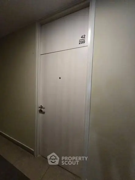 Modern apartment door with sleek design and room number, ideal for urban living.