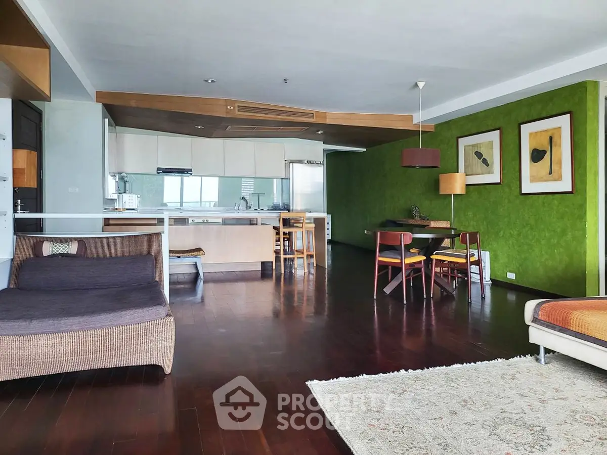 Spacious open-plan living room with modern kitchen and stylish decor