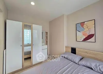 Modern bedroom with stylish decor and ample natural light