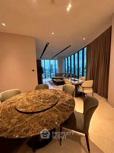 Luxurious living room with panoramic city view and elegant marble dining table.