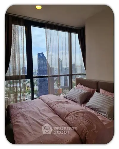 Luxurious bedroom with stunning city view and elegant decor