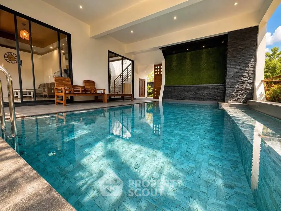 Luxurious indoor pool with modern design and elegant seating area