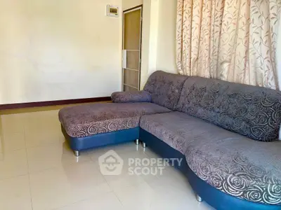 Spacious living room with elegant sofa and natural light