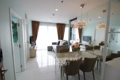Modern living room with elegant dining area and stylish decor