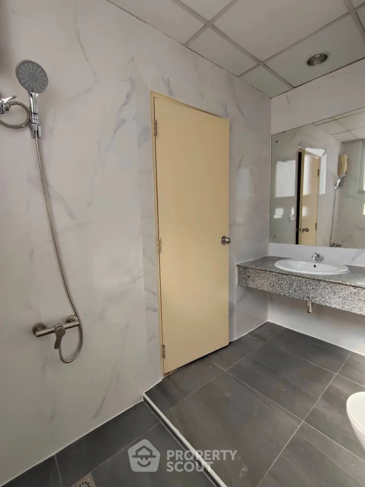 Modern bathroom with sleek shower and elegant marble tiles