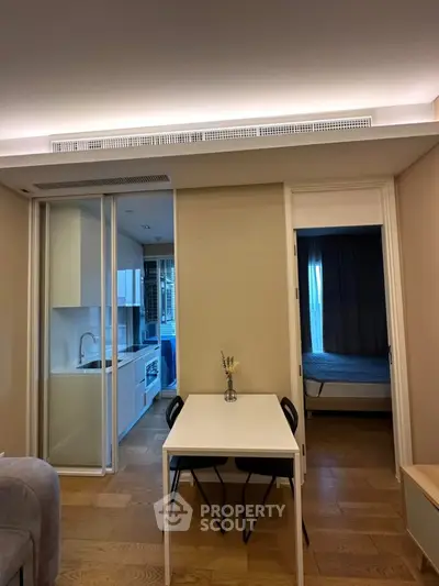 Modern compact apartment with open kitchen and cozy dining area