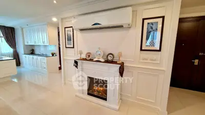 Elegant living room with fireplace and modern kitchen in luxury apartment