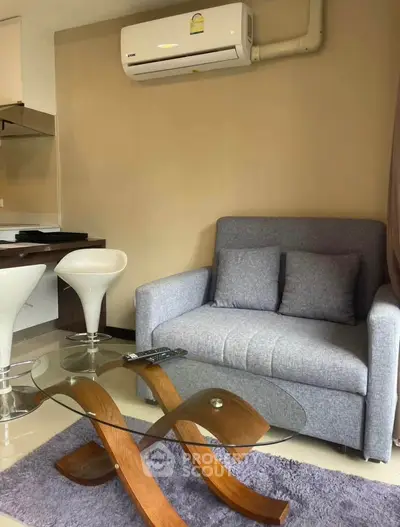 Modern living room with stylish furniture and air conditioning in a cozy apartment.