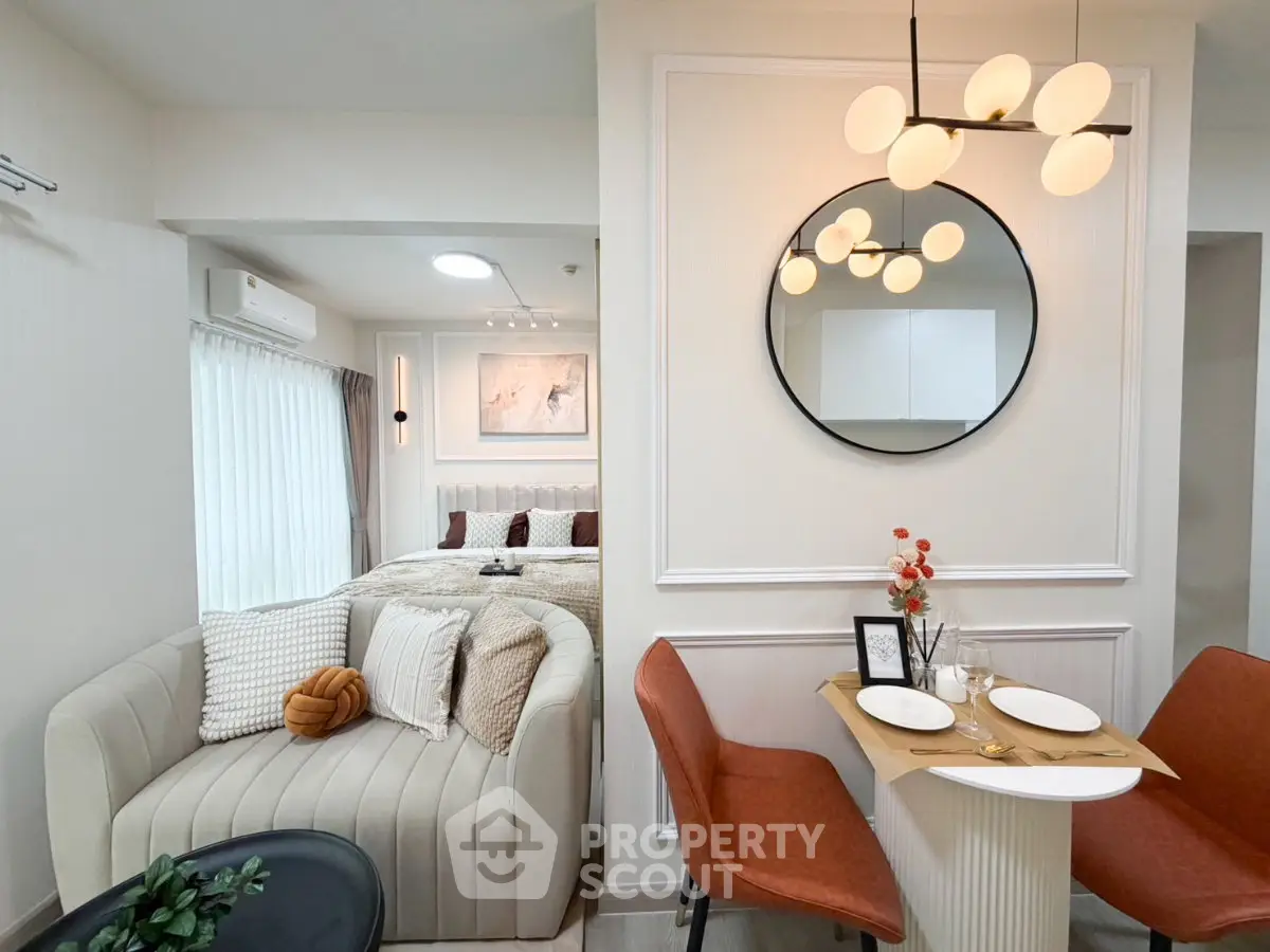 Modern studio apartment with stylish decor and cozy dining area