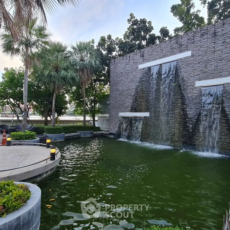 Luxurious garden with stunning waterfall feature and lush greenery
