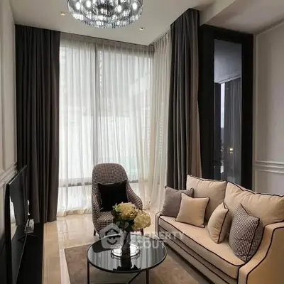 Elegant living room with modern decor and large windows in a luxury apartment.