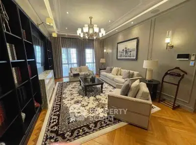 Luxurious living room with elegant decor, plush seating, and stylish lighting in a sophisticated home.