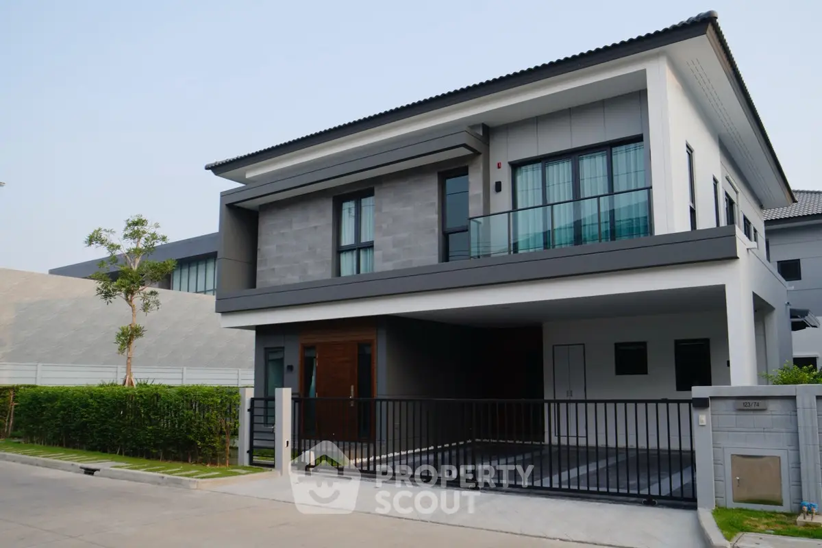 Modern two-story house with sleek design and spacious driveway
