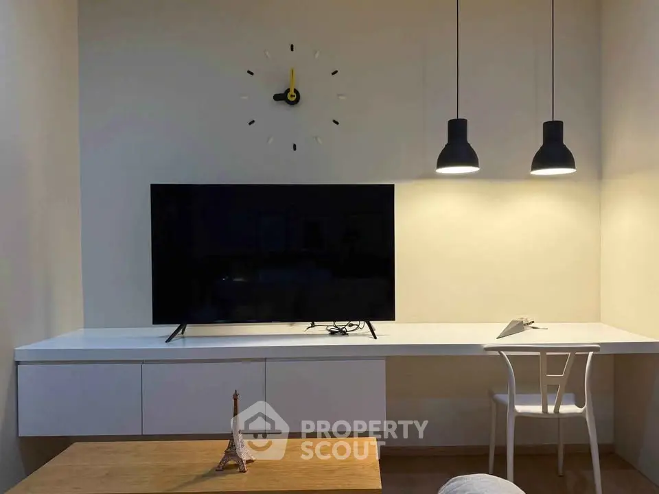 Modern living room with sleek TV setup and stylish lighting