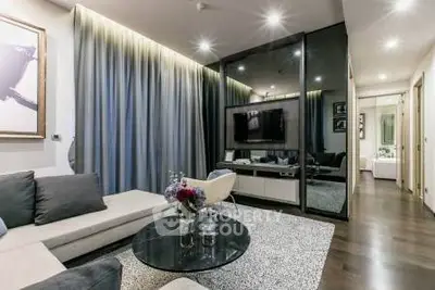 Modern living room with sleek design, featuring a cozy sofa, stylish decor, and ambient lighting.