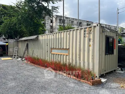 Innovative container home with modern design and landscaped surroundings