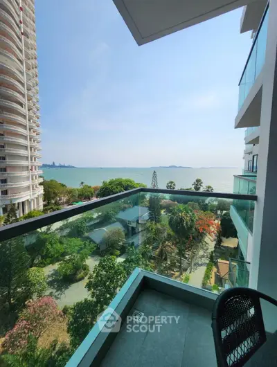 Stunning ocean view from modern balcony in high-rise building, perfect for relaxation and enjoying the scenery.