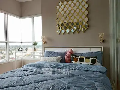 Luxurious bedroom with panoramic city views and stylish decor