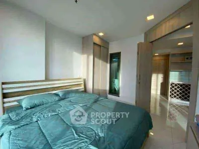 Spacious bedroom with modern design and ample natural light