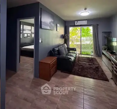 Spacious living room with modern decor and large window view